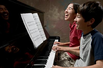 Playing the piano in a group helps students to stay interested and involved.